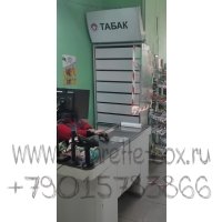 Фотография торгового шкафа для продажи сигарет с десятью складными дверями с световым фризом  в открытом виде